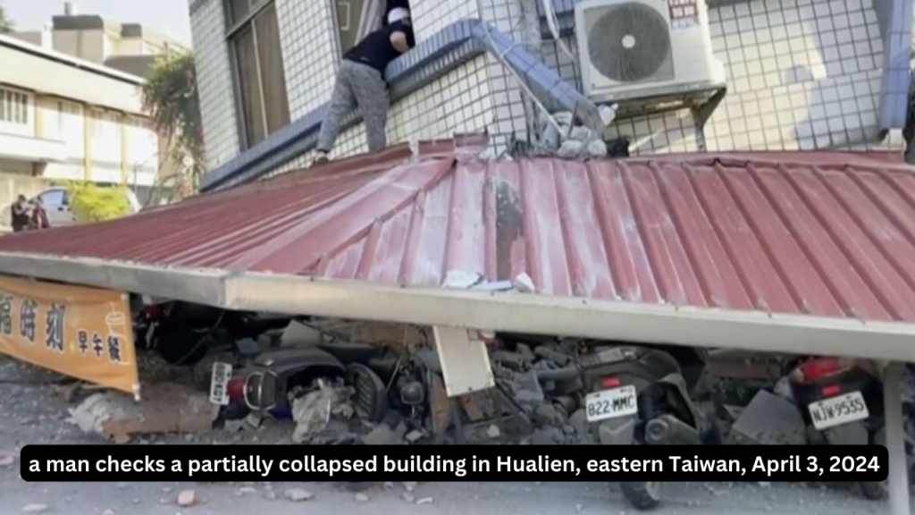 a man checks a partially collapsed building in Hualien, eastern Taiwan, April 3, 2024